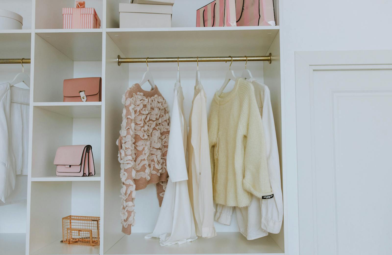 Organized white closet showing careful household sorting